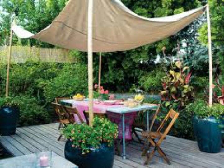 DIY Outdoor Shade Canopy
 Canvas drop cloth 12 00 home depot and planters for a