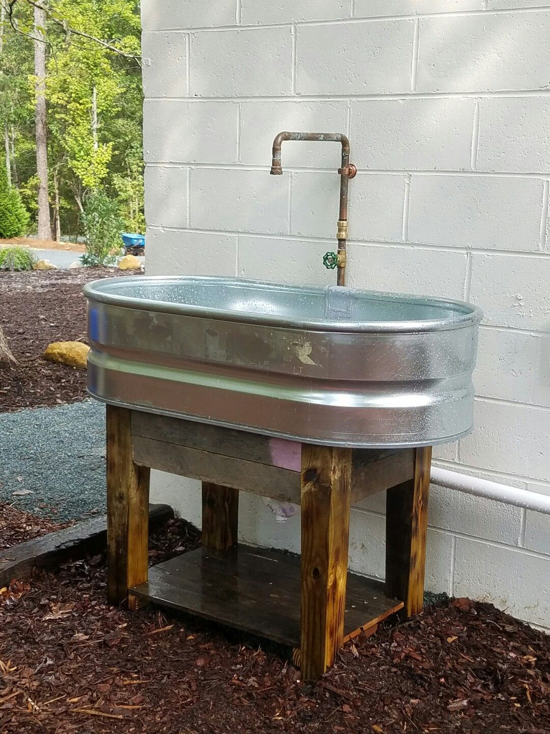 DIY Outdoor Sink
 Stock tank sink Pallet wood base