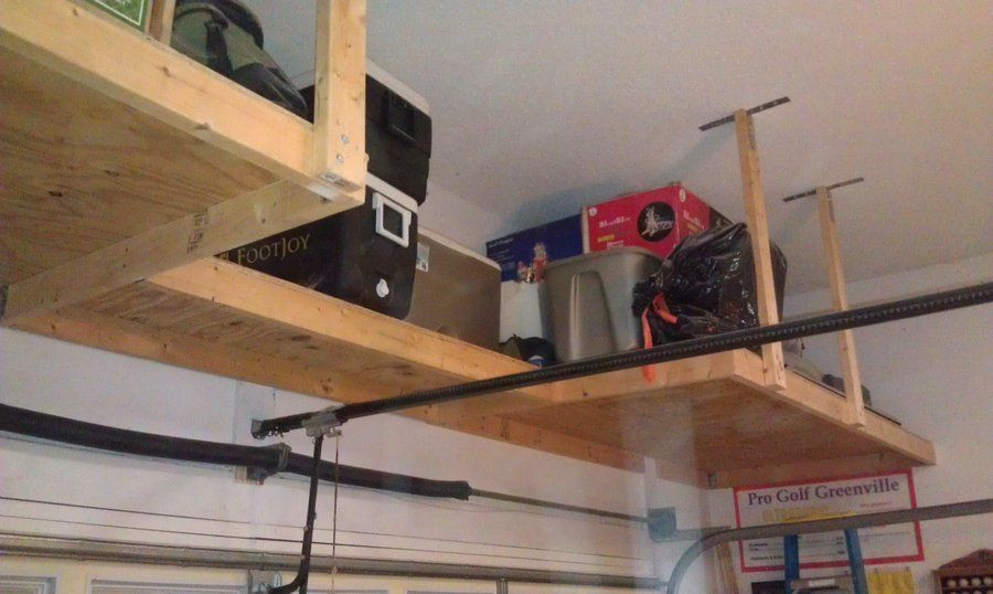 DIY Overhead Garage Storage Plans
 over garage door shelf