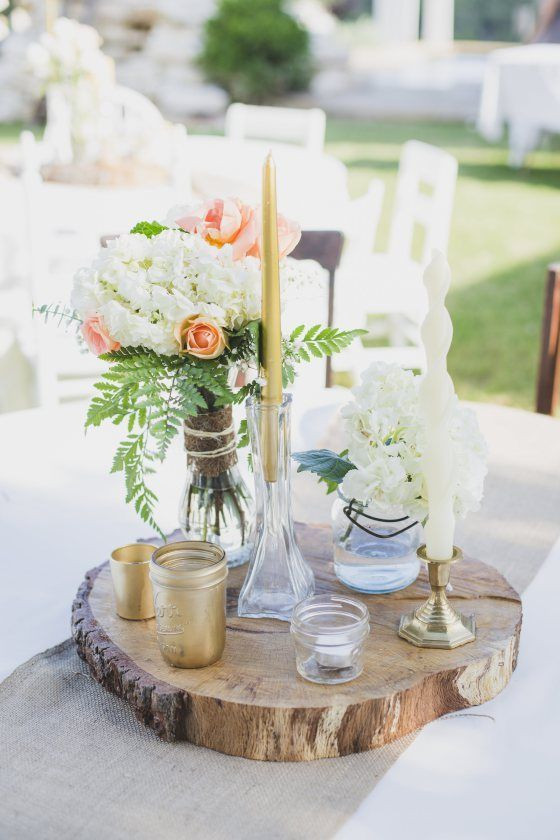 DIY Wood Slab Centerpieces
 This rustic wood slab centerpiece would be perfect for a