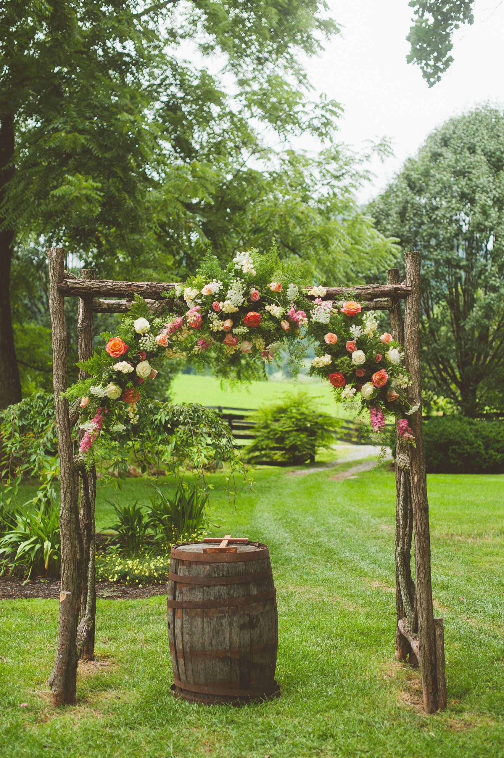 DIY Wood Wedding Arch
 Wooden Wedding Arch With Coral Flowers
