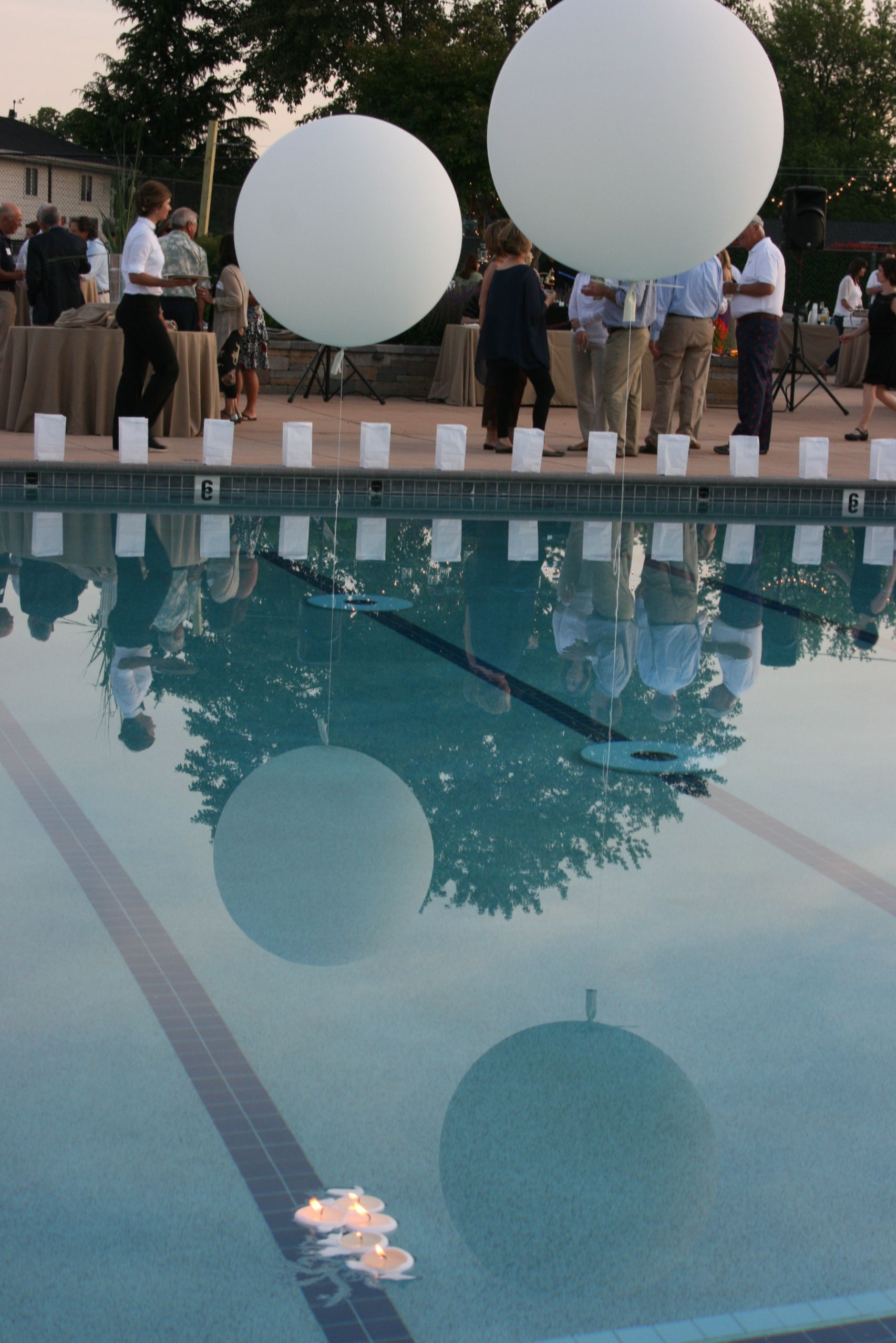 Elegant Pool Party Ideas
 large balloon with weighted ends in pool