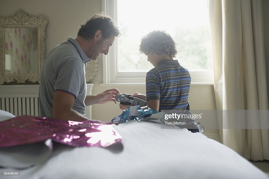 Father Son Christmas Gift Ideas
 Father Giving Son Christmas Gift High Res Stock