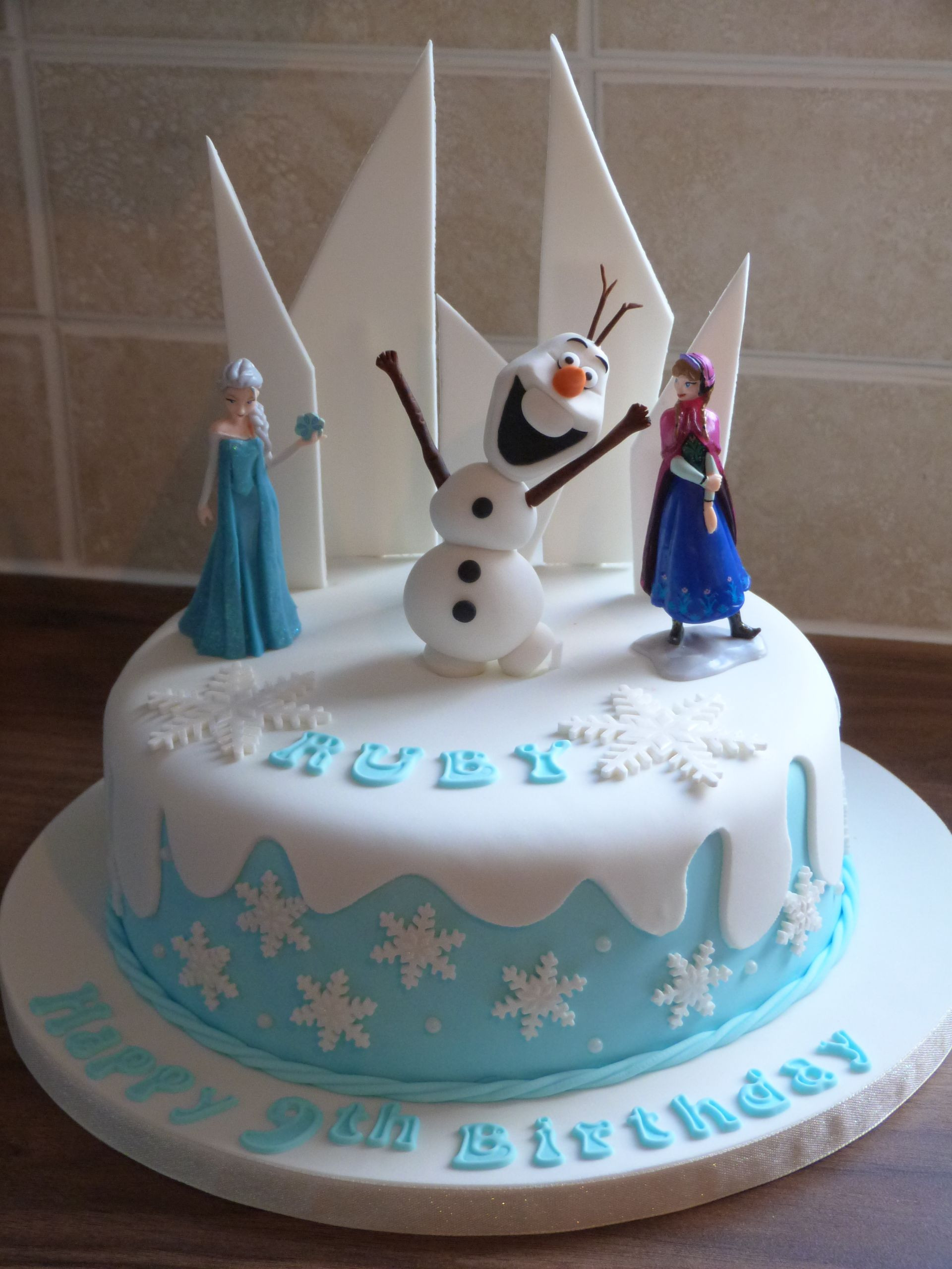 Frozen Birthday Cake Decorations
 Frozen themed cake with a hand made Olaf Frozen Party Ideas in 2019