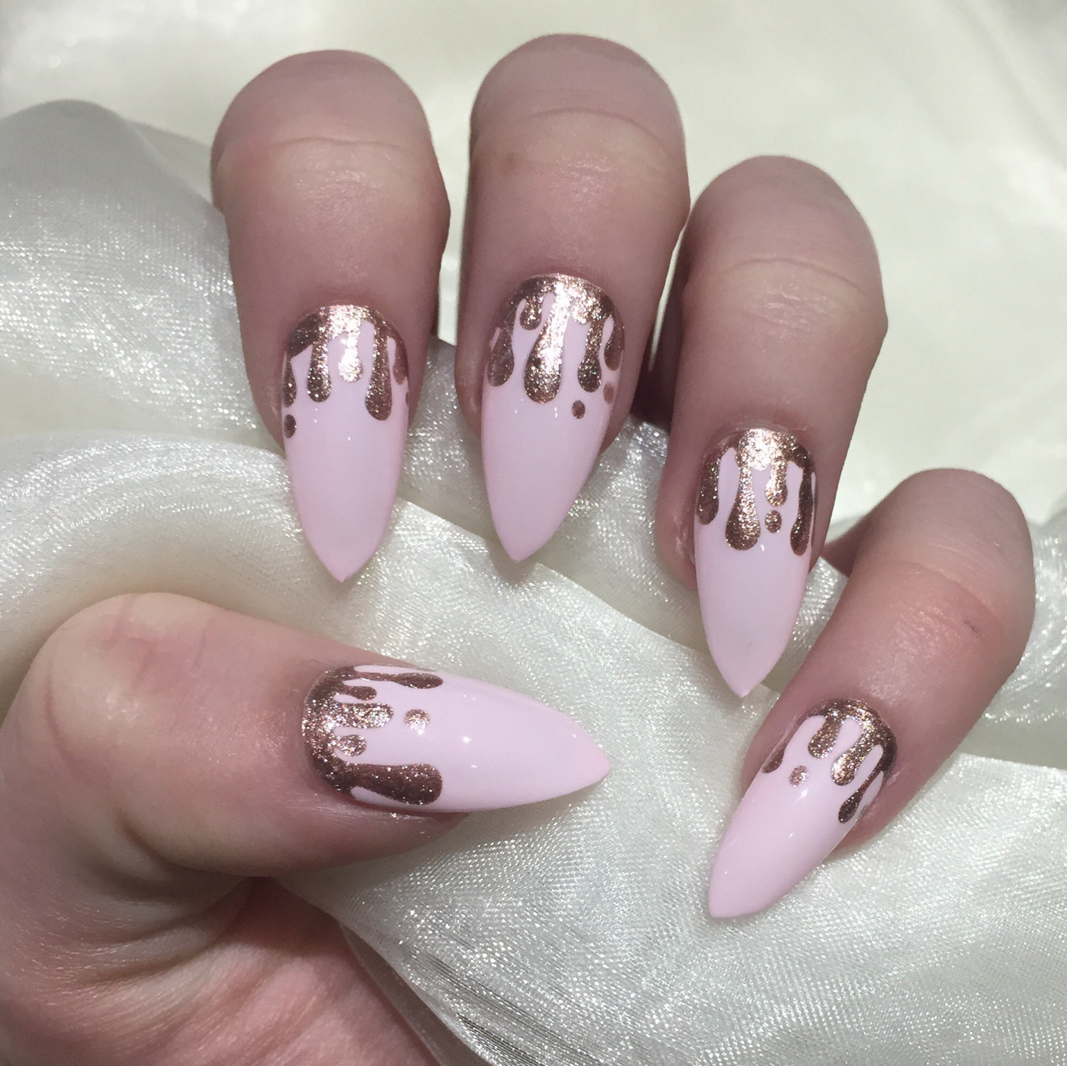 Glitter Stiletto Nails
 Baby pink stiletto false nails with rose gold glitter drip