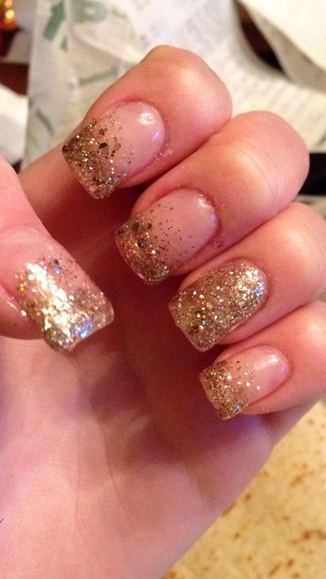 Gold Glitter Tips Nails
 Sparkly glittery gold French tips that fade into the nail