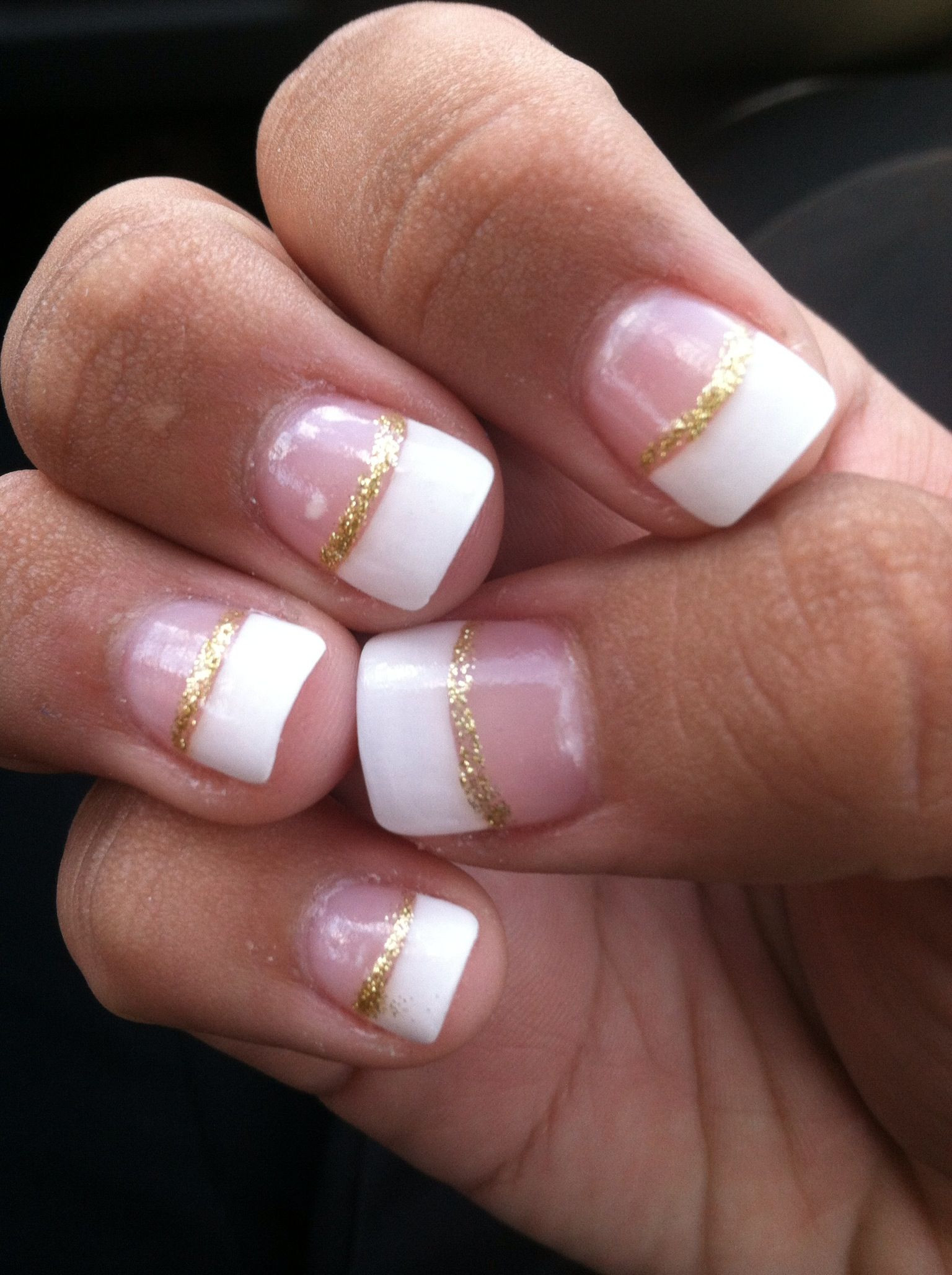 Gold Glitter Tips Nails
 White French tip with gold glitter manicure