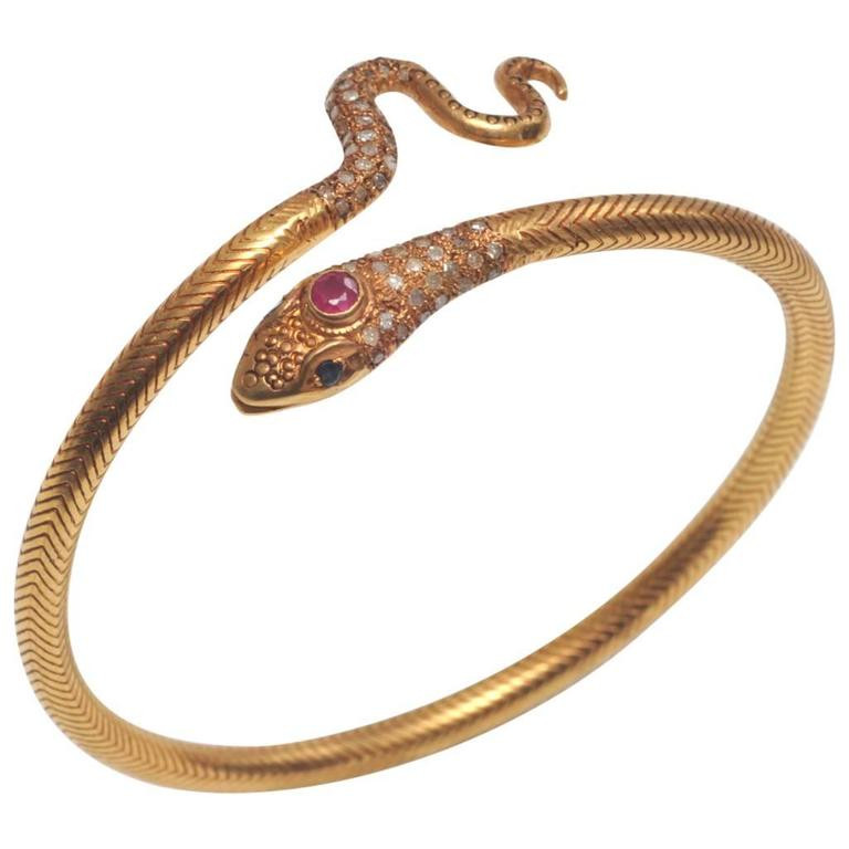 Gold Snake Bracelet
 18K Gold Snake Bracelet with Pave Diamonds Ruby and