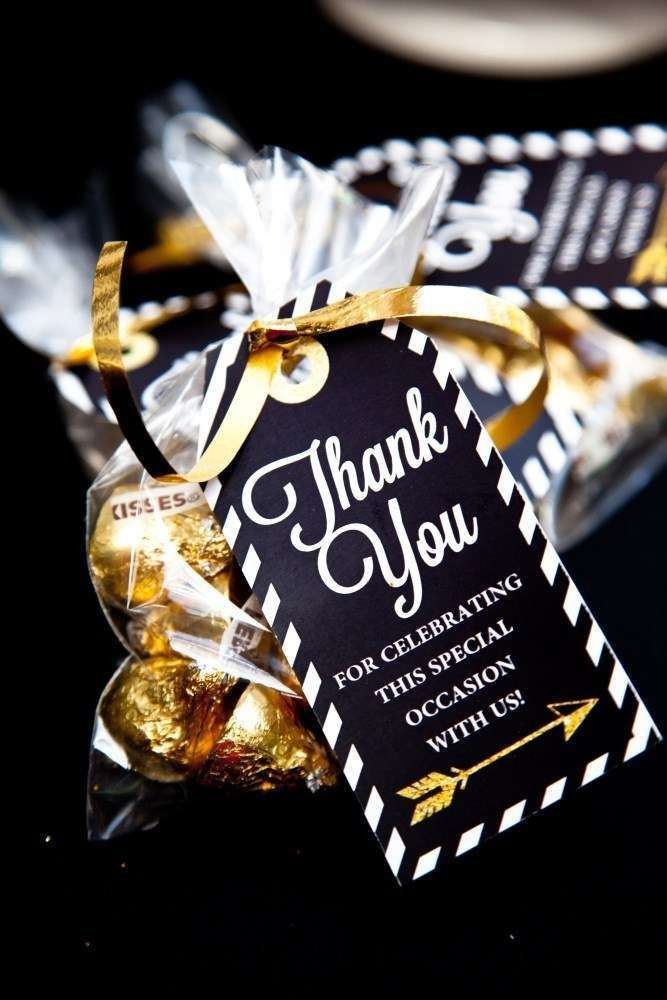 Graduation Party Gift Ideas For Guests
 Thank you favors at a black and gold graduation party See