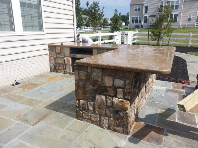 Granite Outdoor Kitchen
 Outdoor kitchen with bar and granite countertops