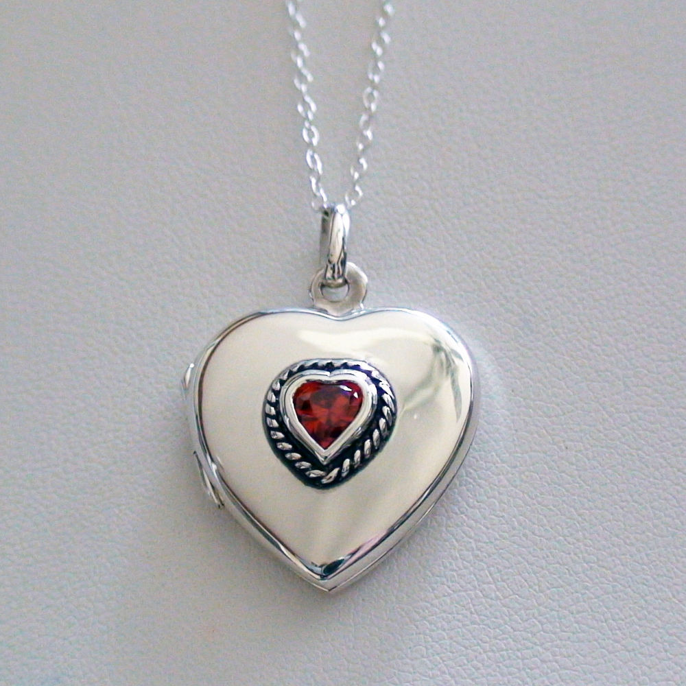 Heart Locket Necklace
 Heart Locket Necklace w CZ 925 Sterling Silver Holds 2