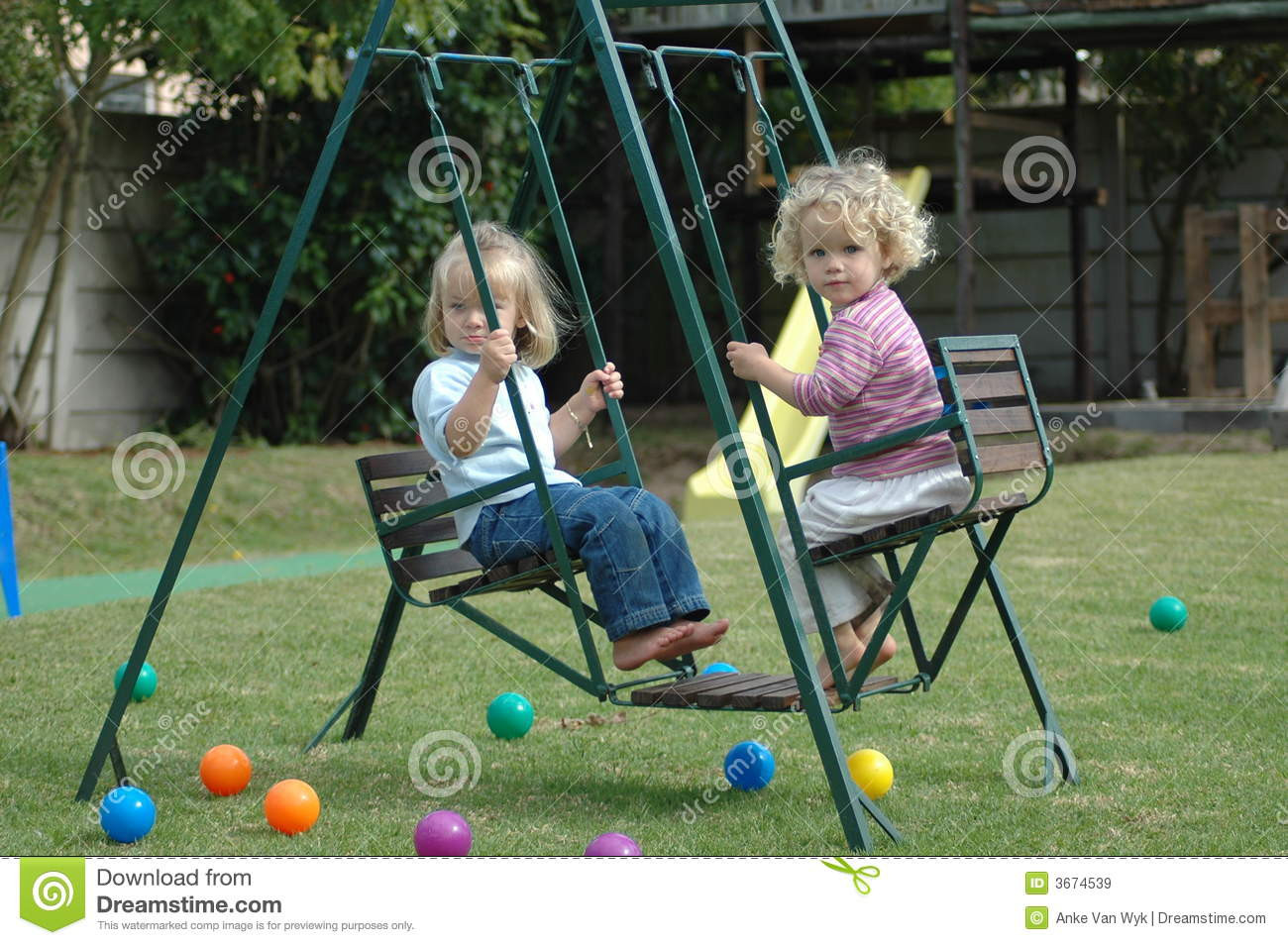 Kids Double Swing
 Children on swing stock image Image of active double