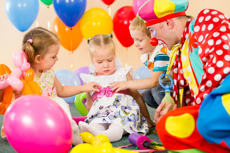 Kids Party Clown
 Kids Boy And Girls With Clown Birthday Party Stock