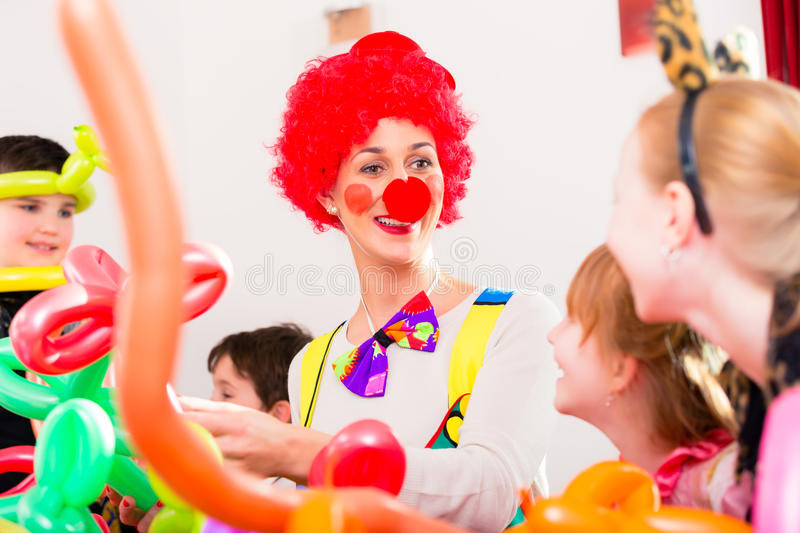 Kids Party Clown
 Clown At Children Birthday Party With Kids Stock Image