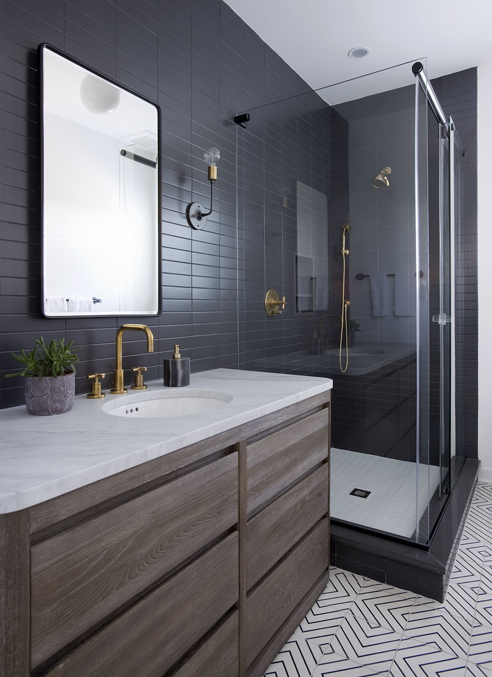 Modern Bathroom Tiles Design
 Sleek modern dark bathroom with glossy tiled walls