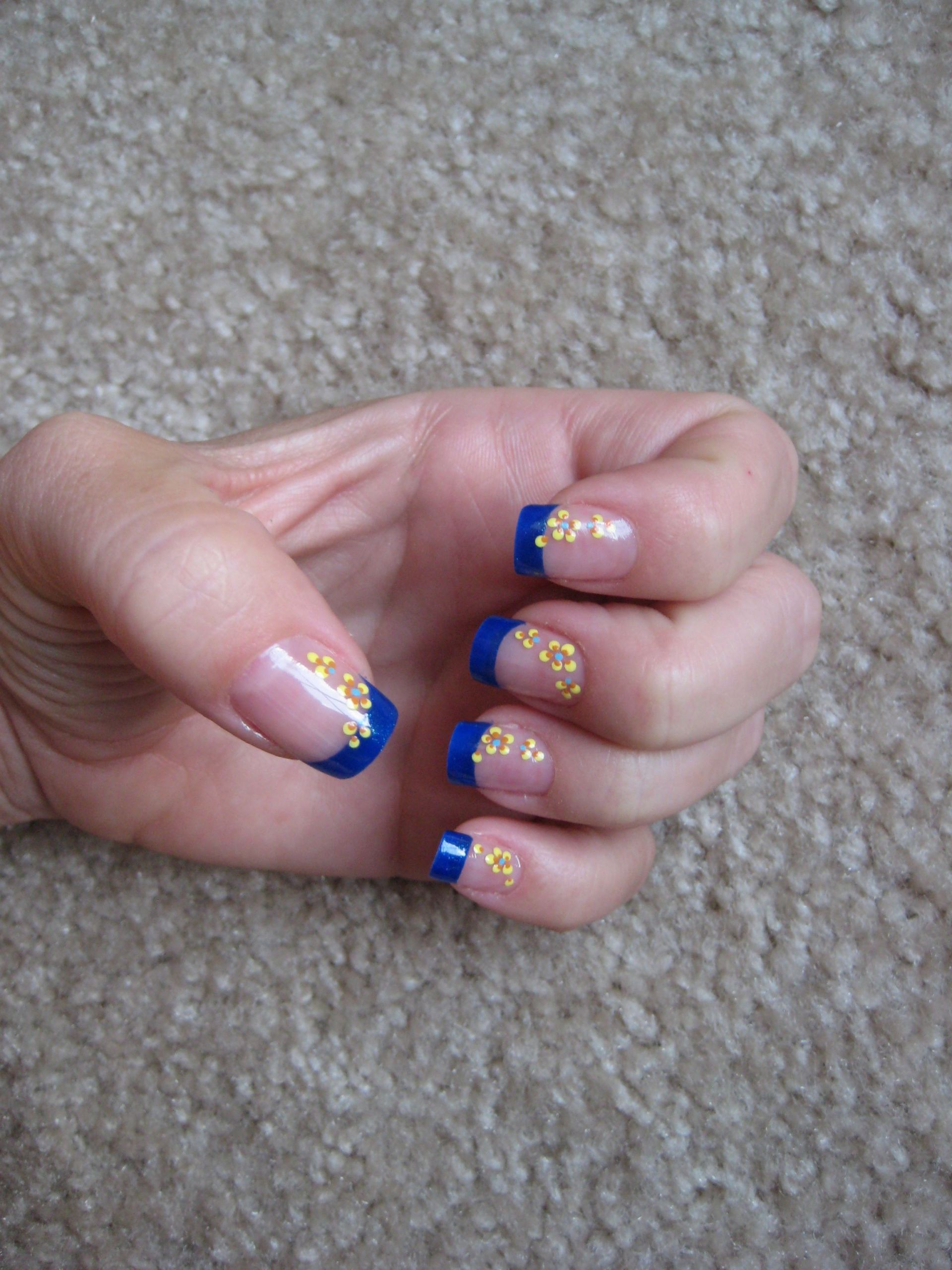 Orange And Blue Nail Designs
 Royal blue tips with yellow orange flowers great bo