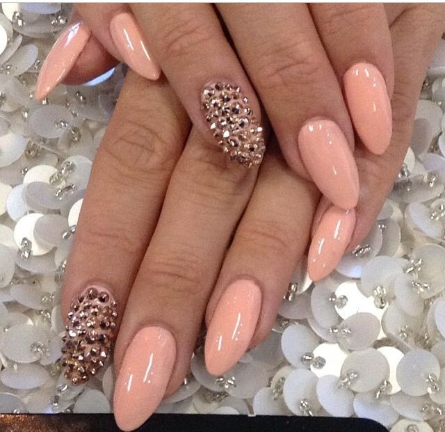 Peach Color Nail Designs
 Peach pointy nails with golden studs