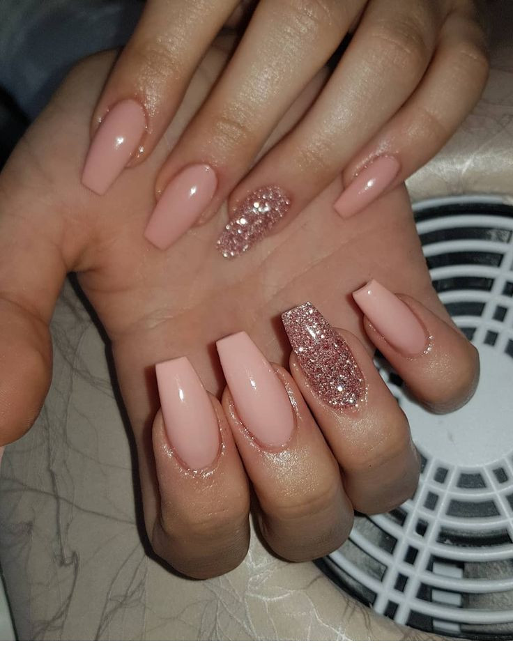 Pink Coffin Nails With Glitter
 Pink coffin nails with glitter