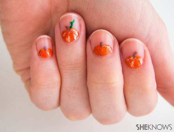Pumpkin Nail Designs
 Peeking pumpkin nail art that is on point for fall