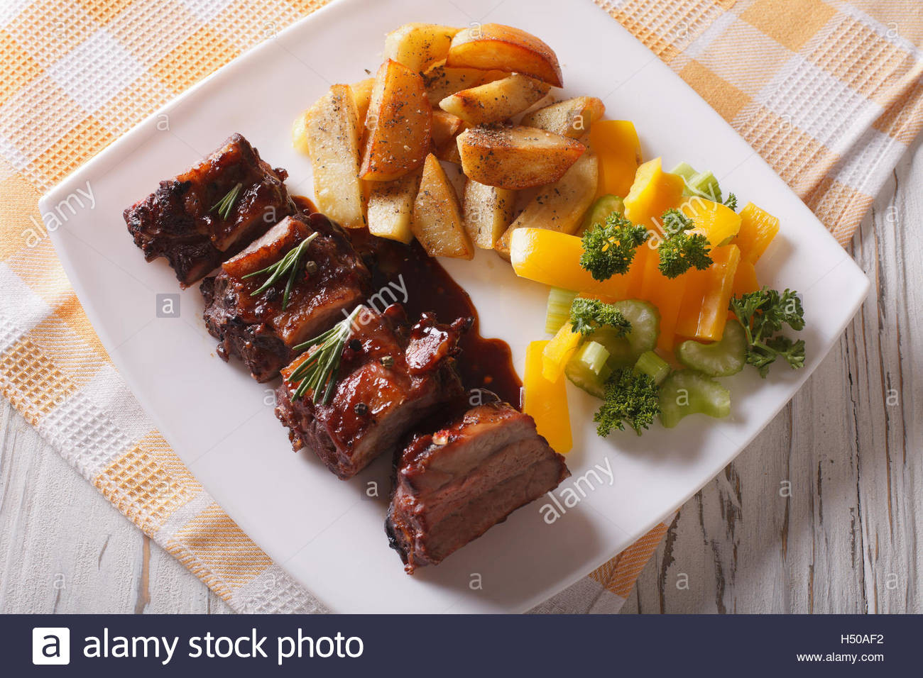 Side Dishes For Bbq Ribs
 BBQ pork ribs with a side dish of ve ables close up on a