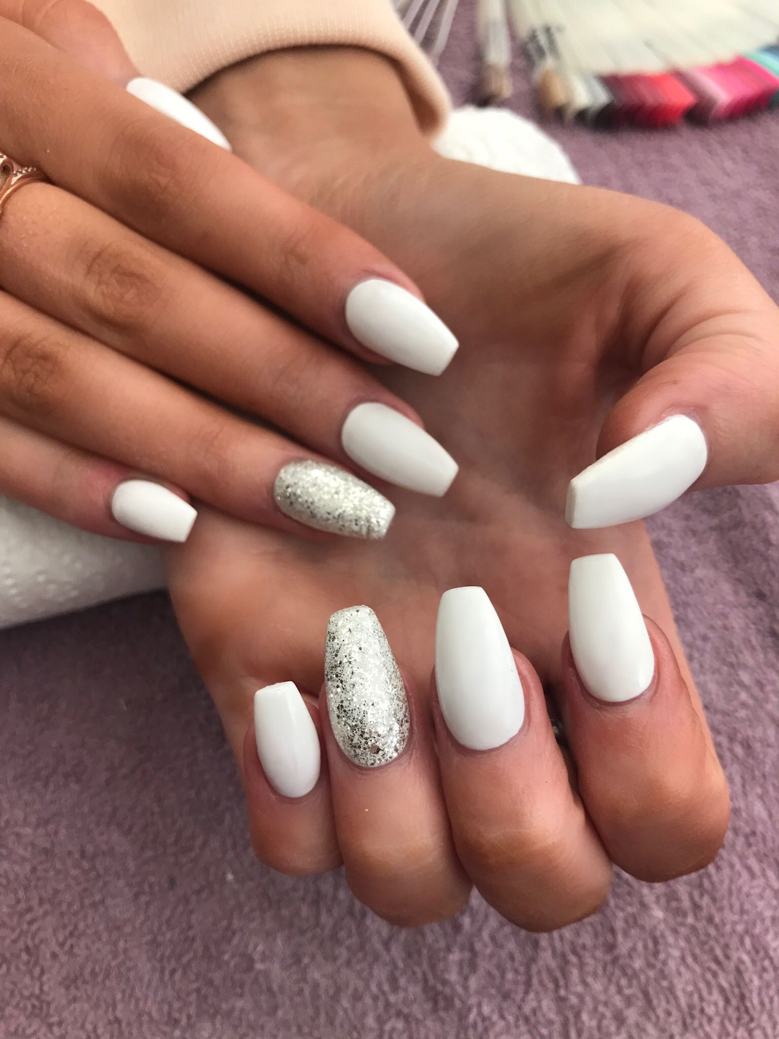 Silver Glitter Coffin Nails
 White coffin shaped acrylic nails with silver glitter