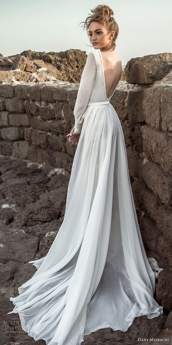 Sleek Wedding Dresses
 Picture a sleek wedding dress with long sleeves an