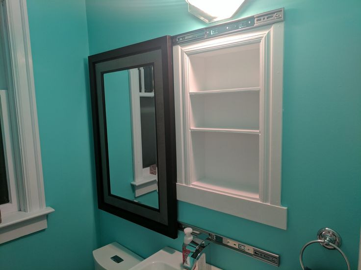 Sliding Bathroom Mirror
 I made a recessed medicine cabinet hidden behind a sliding