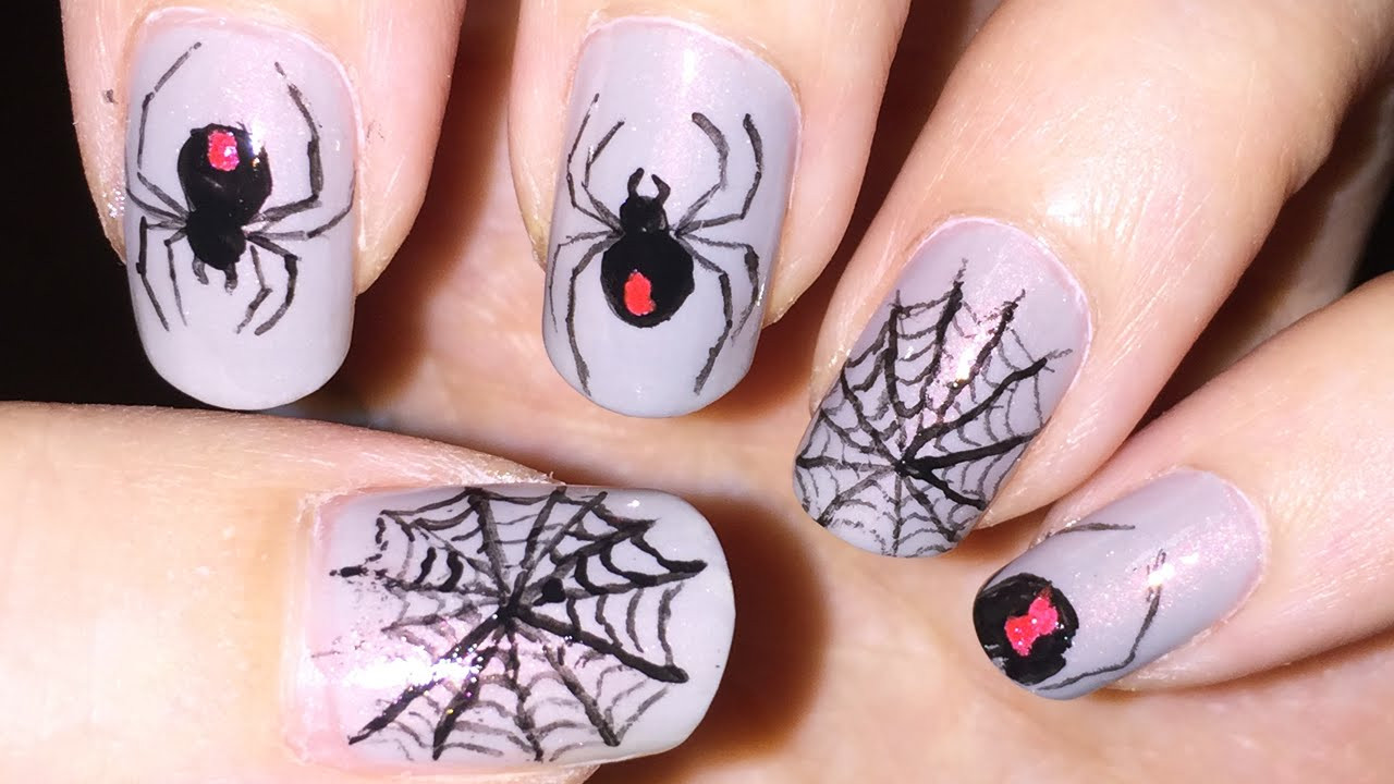 Spider Web Nail Art
 Black widow spider and spider web nail art Halloween