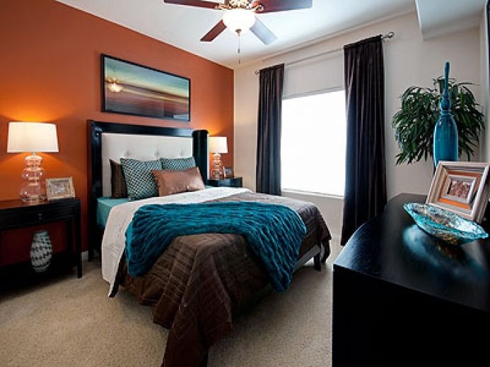 Teal Accent Wall Bedroom
 Love this room The orange accent wall with teal and
