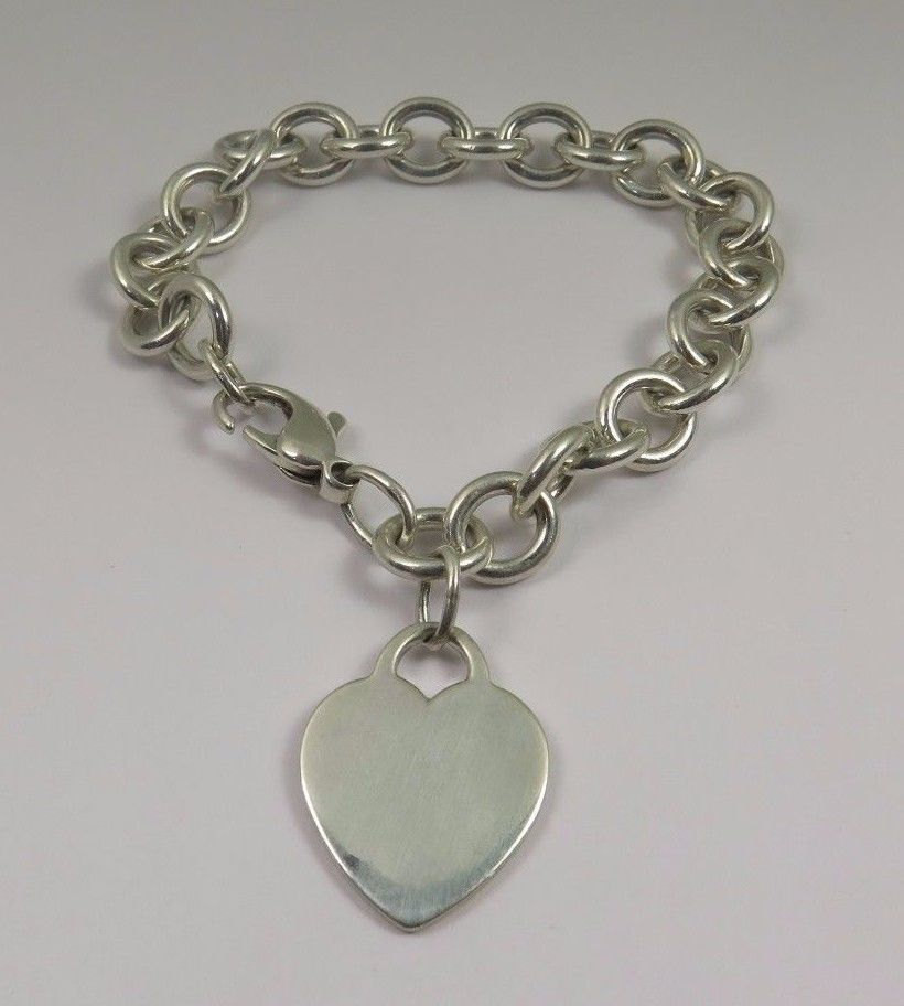 Tiffany Sterling Silver Bracelet
 Tiffany & Co Sterling Silver With Heart Charm Bracelet