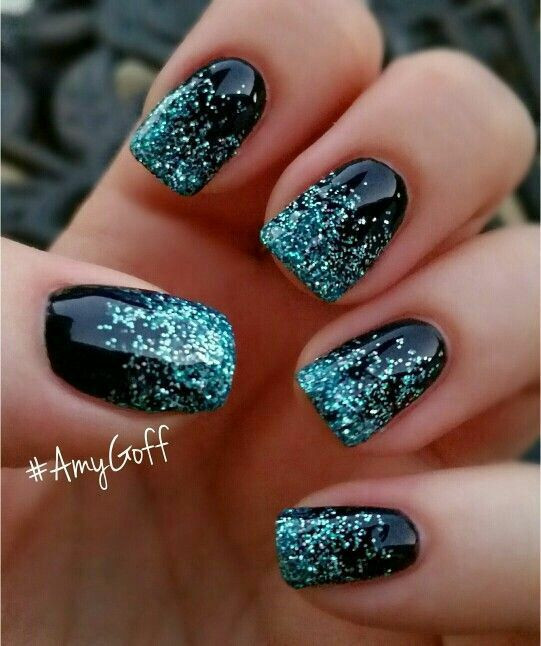 Turquoise Glitter Nails
 Black nails with sparkly turquoise accents