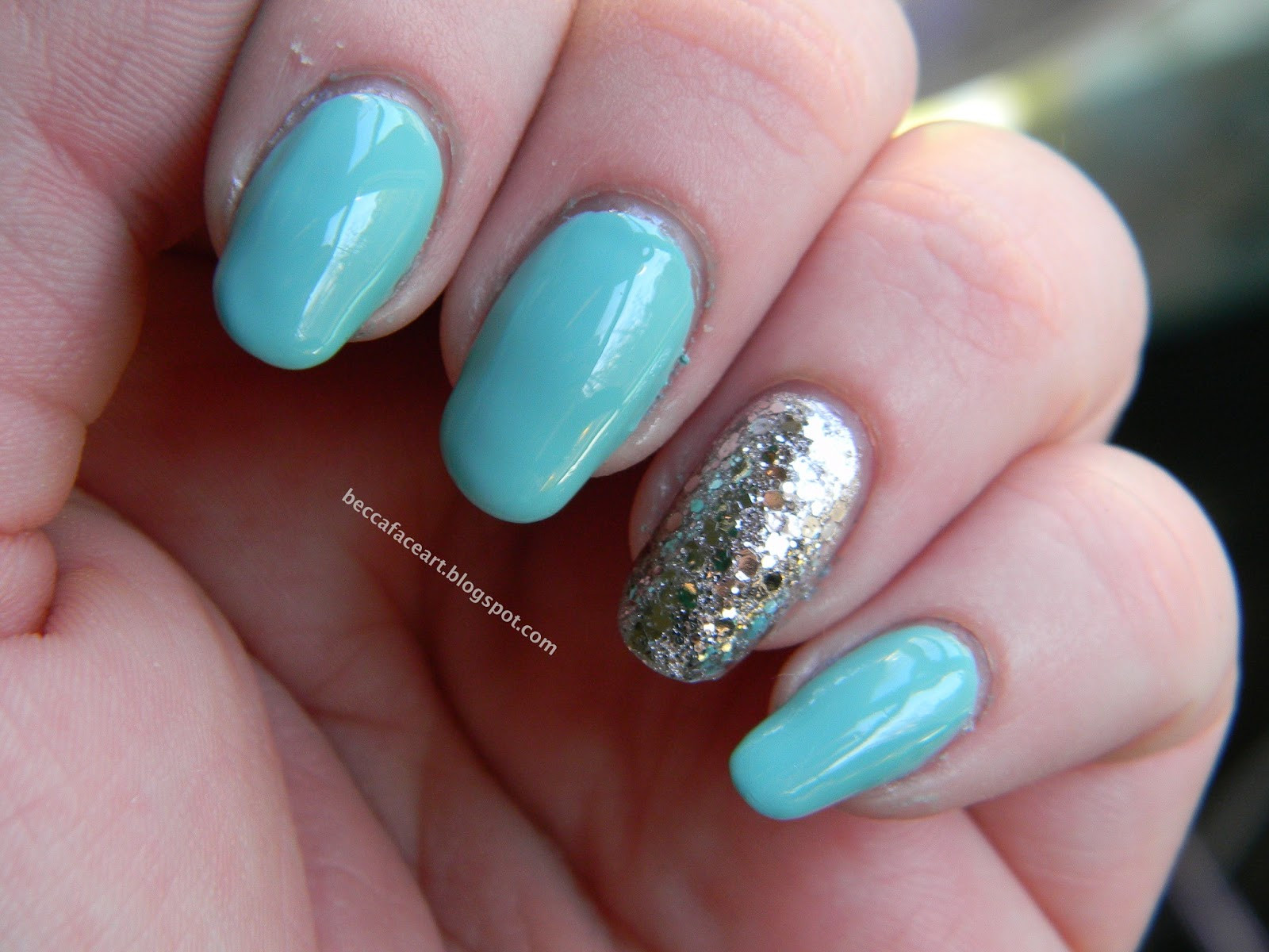 Turquoise Glitter Nails
 Becca Face Nail Art Turquoise and Silver Glitter Nails