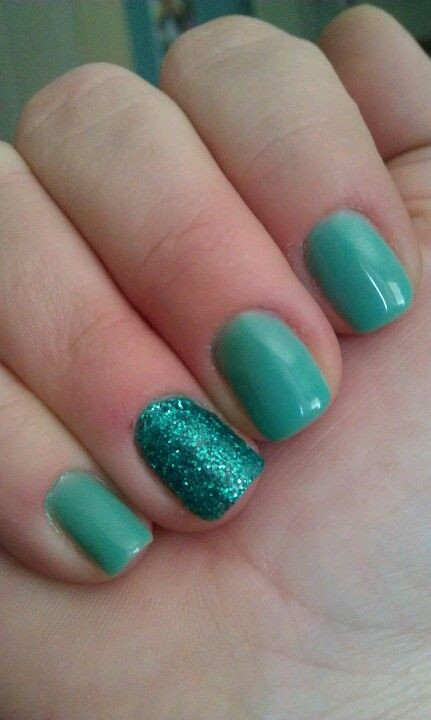 Turquoise Glitter Nails
 Turquoise gel nails with glitter accent