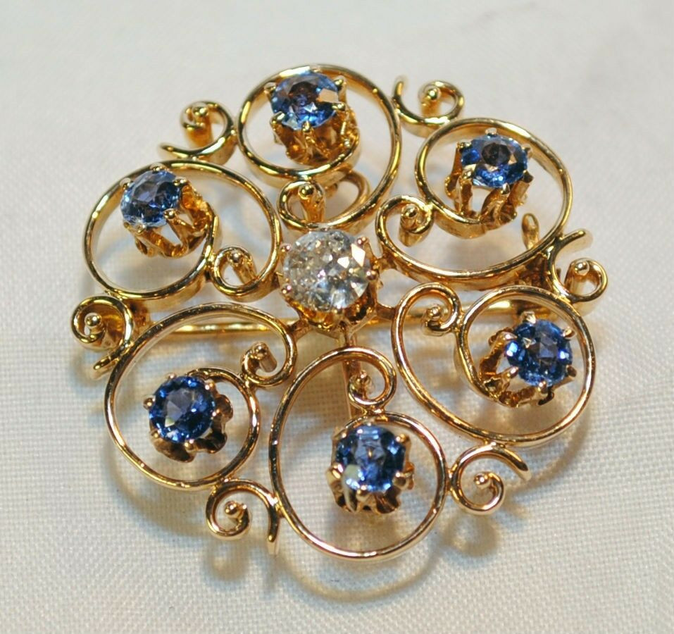 Vintage Pins
 VINTAGE SAPPHIRE AND DIAMOND SCROLL BROOCH PIN AND PENDANT