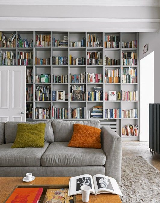 Wall Shelves Living Room
 This grey living room with floor to ceiling bookcases uses