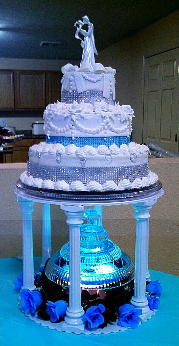 Wedding Cake With Fountain
 Three tiered silver and teal aqua blue wedding cake with