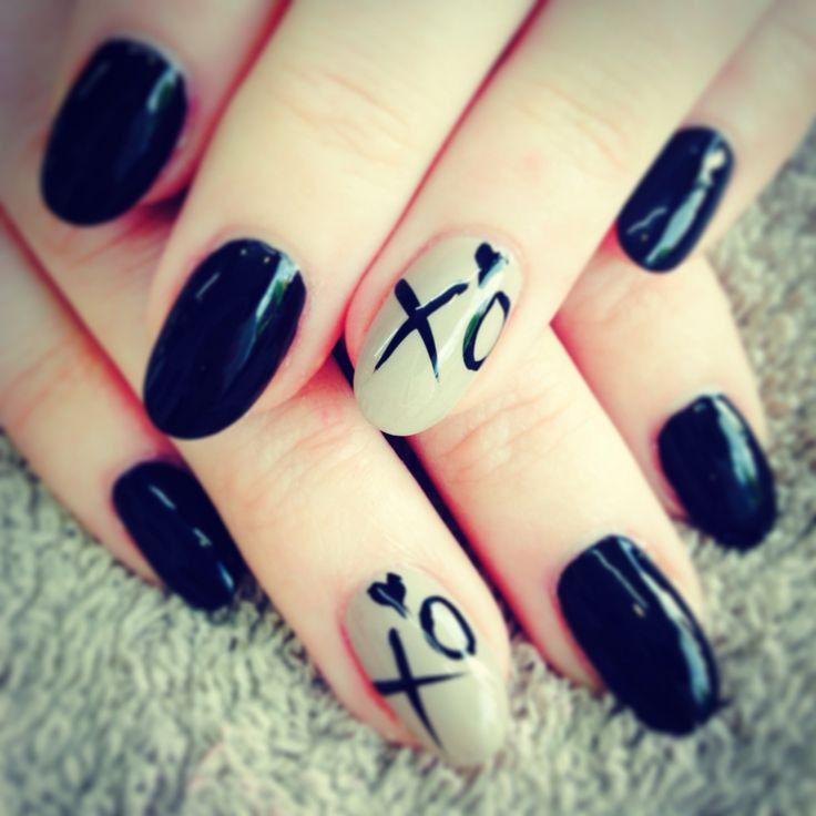 Xo Nail Designs
 Black almond nails with XO ring finger nail design