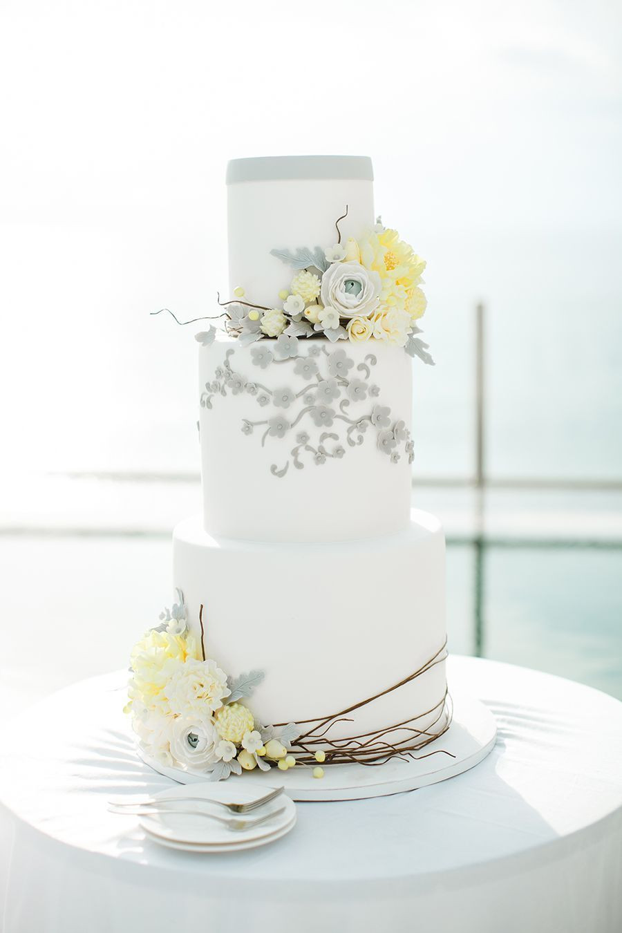 Yellow And Gray Wedding Cakes
 Grey white and yellow tiered wedding cake with florals