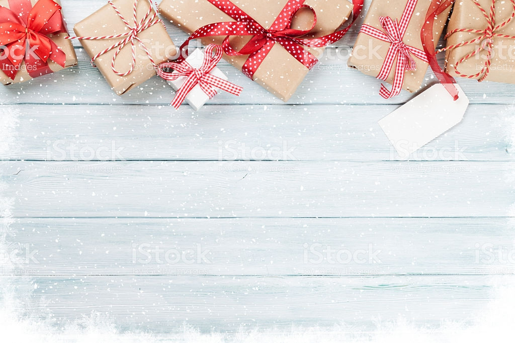 Christmas Gift Background
 Christmas Wooden Background With Gift Boxes And Snow stock